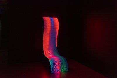 Daniel Canogar Billow III, wavy LED sculpture emitting red and green light